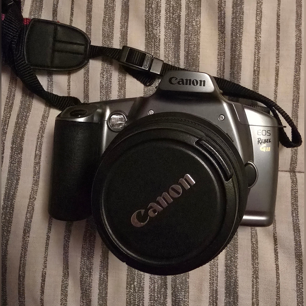 Canon EOS Rebel GII 35mm SLR Camera - Silver & Black with shoulder strap